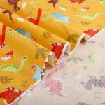 tissu dinosaure au metre jaune
